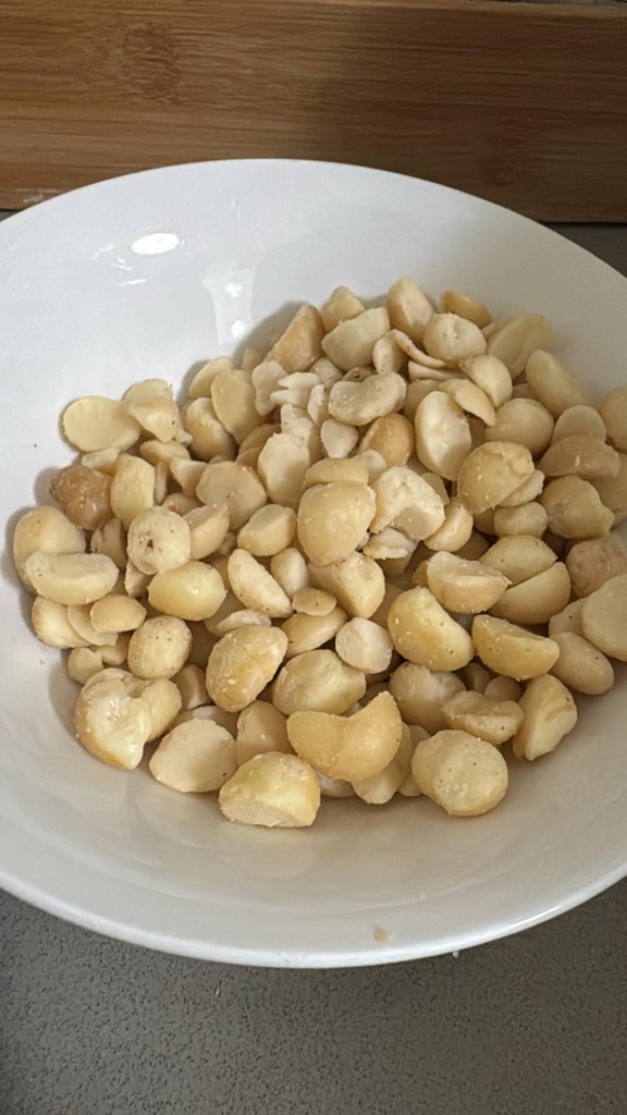 Fresh raw Australian macadamia halves bowl